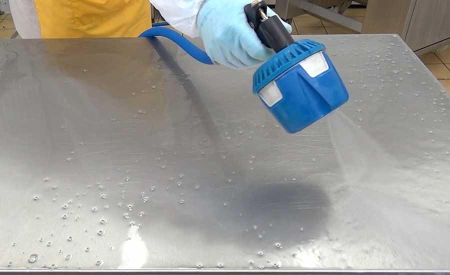 man cleaning table