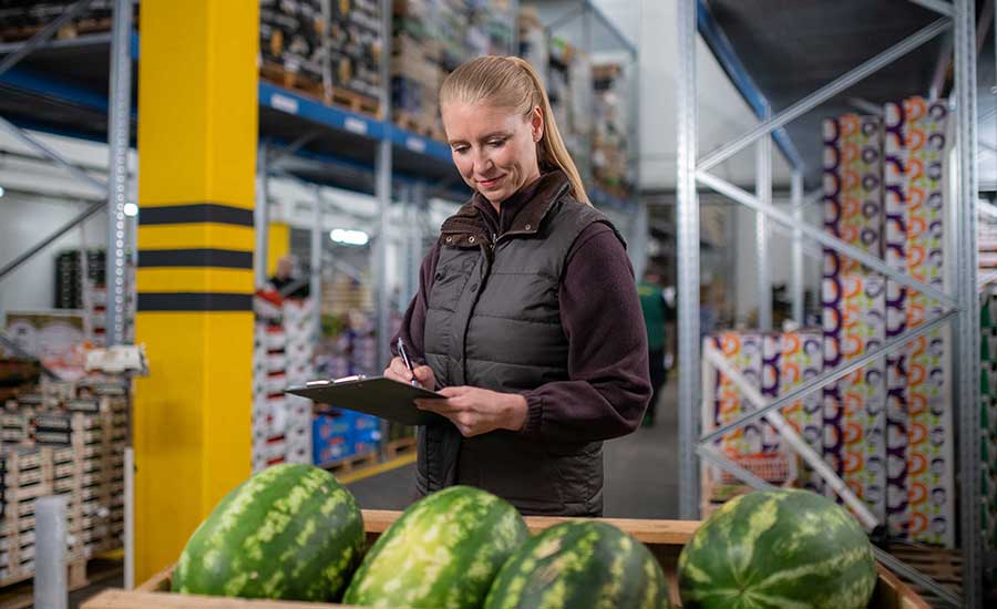 woman inspecting food