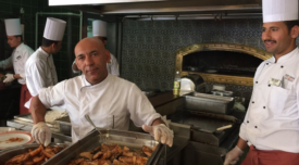 kitchen staff man looking at camera