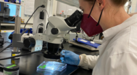 Ocean Conservancy scientist using microscope