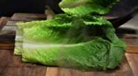 romaine leaves on wood table